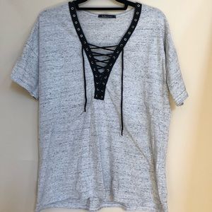 Grey shirt sleeve with black lace up ties